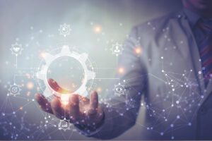 Person holding a metaphorical gear