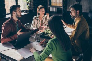 Group of professionals chatting a conference table