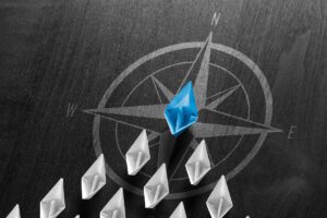 A compass with diamond shapes pointing North