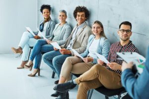 Line of professional seated on a bench