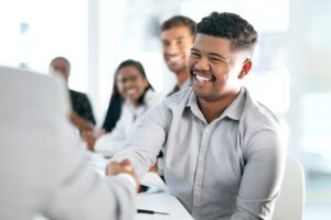 Man shaking hands with another person
