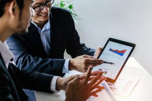 Happy professionals using a tablet