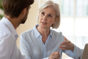 A professional man and woman talking